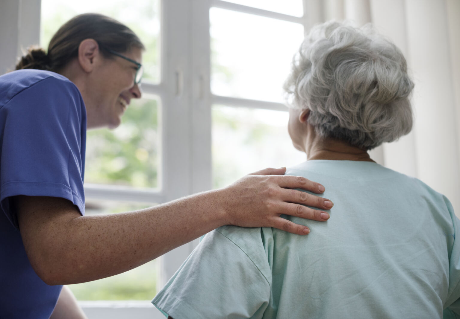 nurse taking care old woman - Booking-Senior.com